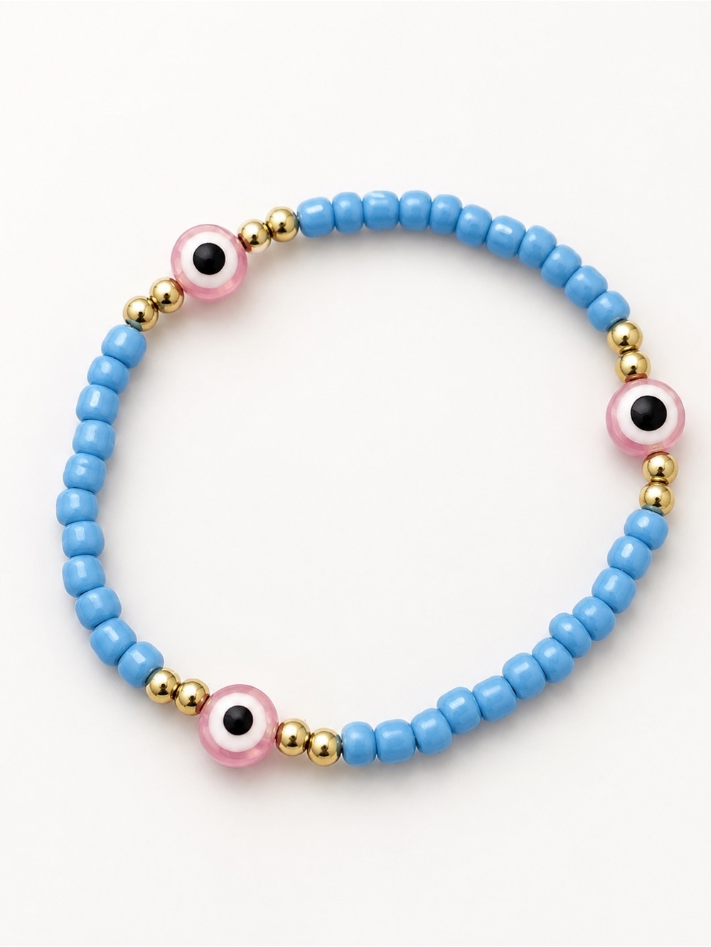 Blue Bead Bracelet with Pink Eye Accents #49